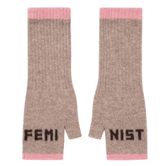 A flat lay photo of the Black & Beech Feminist Gloves in oatmeal beige with dark brown writing and light pink cuffs on a white background.