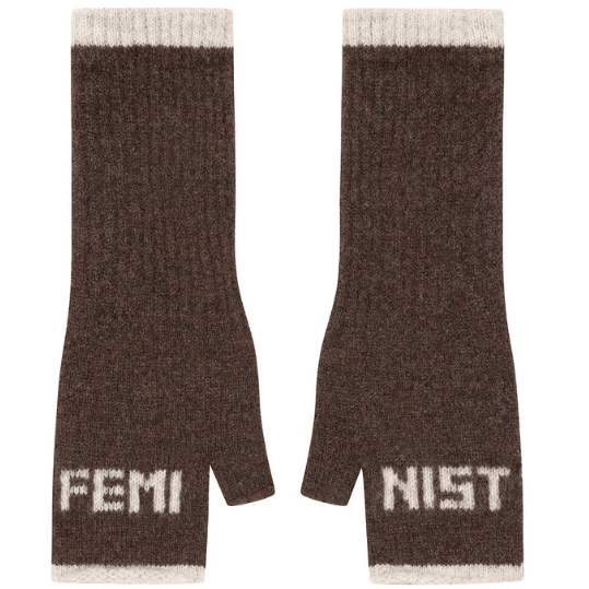 A flat lay photo of the Black & Beech Feminist Gloves in dark brown with cream writing and cuffs on a white background.