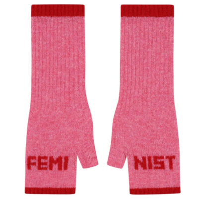 A flat lay photo of the Black & Beech Feminist Gloves in bubblegum pink with red writing and cuffs on a white background.