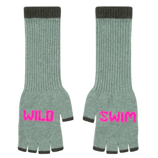 A flat lay photo of the Black & Beech Wild Swim fingerless gloves in turquoise with neon pink writing and dark green cuffs on a white background.