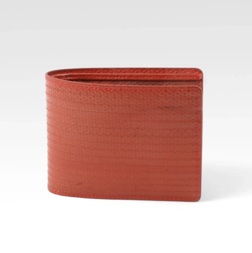 The Elvis and Kresse red billfold wallet in front of a white background