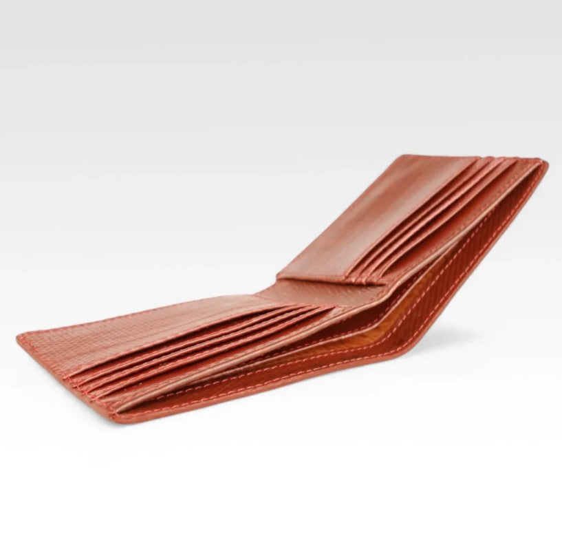 The Elvis and Kresse red billfold wallet in front of a white background