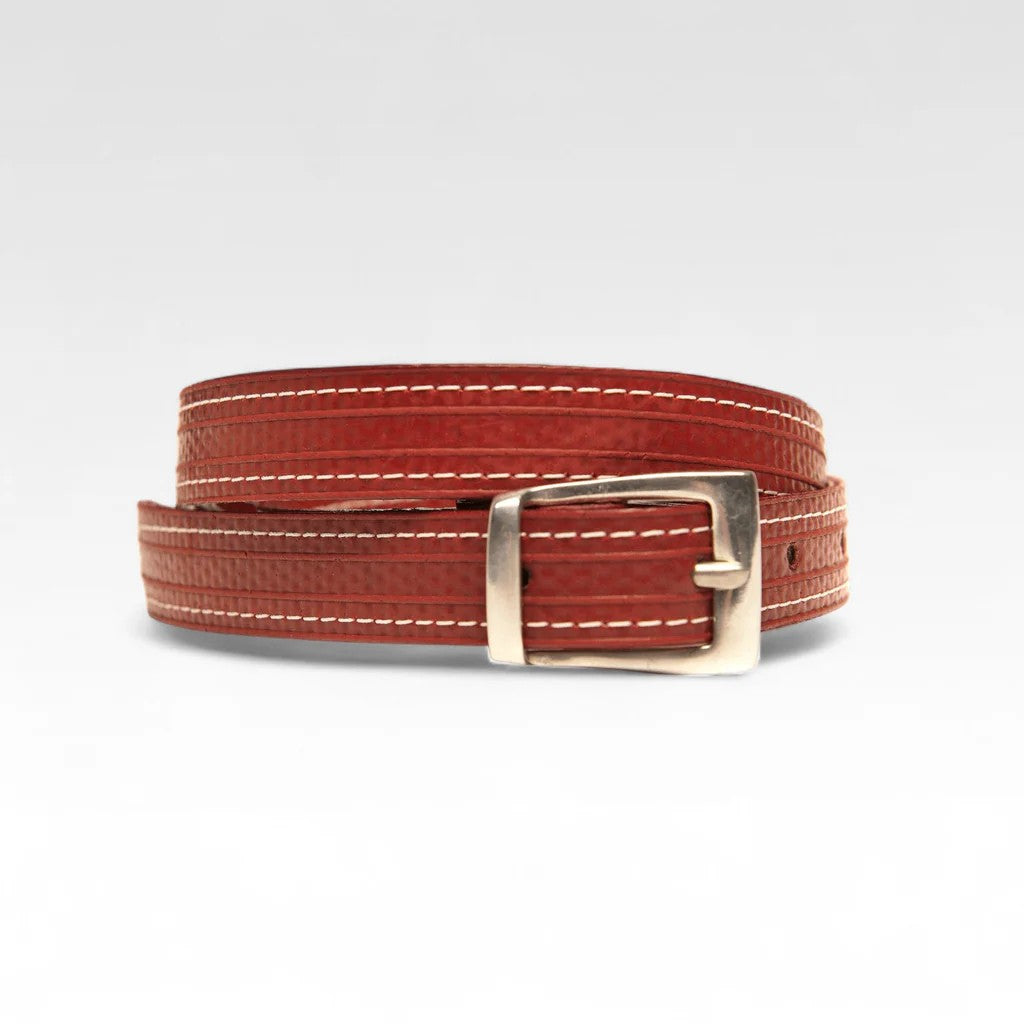 A picture of the red Elvis and Kresse skinny belt on a white backgronf