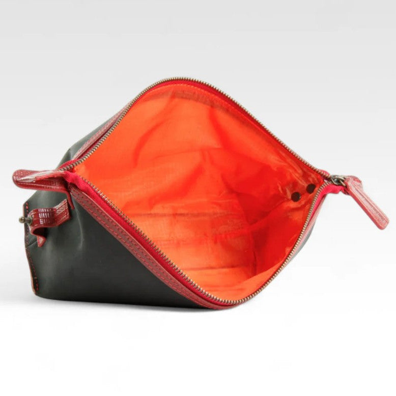 Elvis and Kresse black and red medium washbag open on its side on a white background
