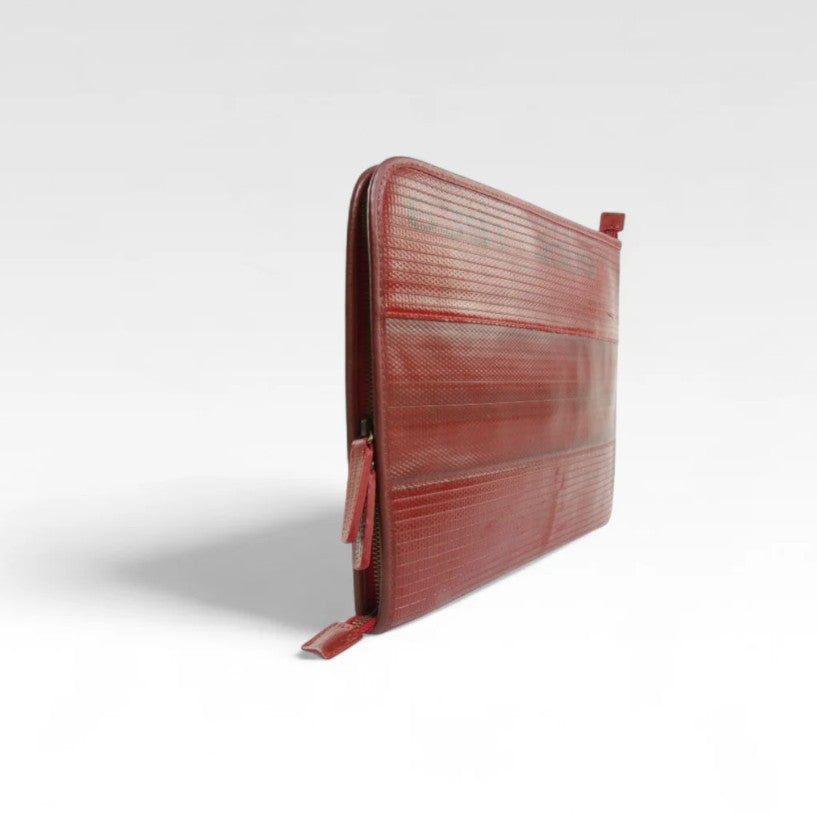 The Elvis and Kresse red laptop case on a white background, side view
