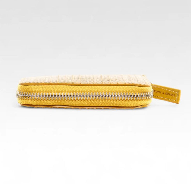 Elvis and Kresse yellow coin pouch laying down flat on a white background