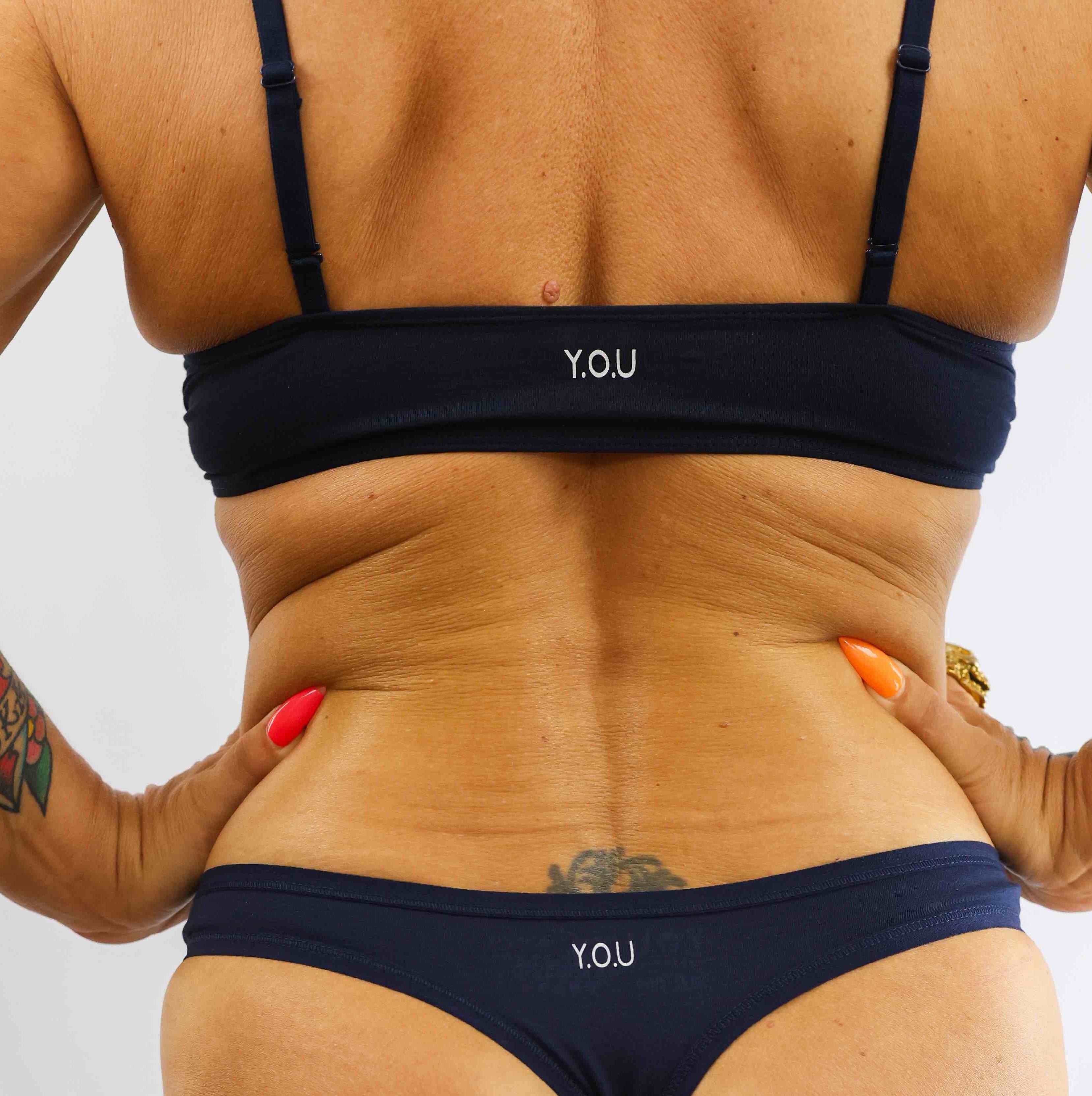 model wearing organic cotton bralette and thong navy