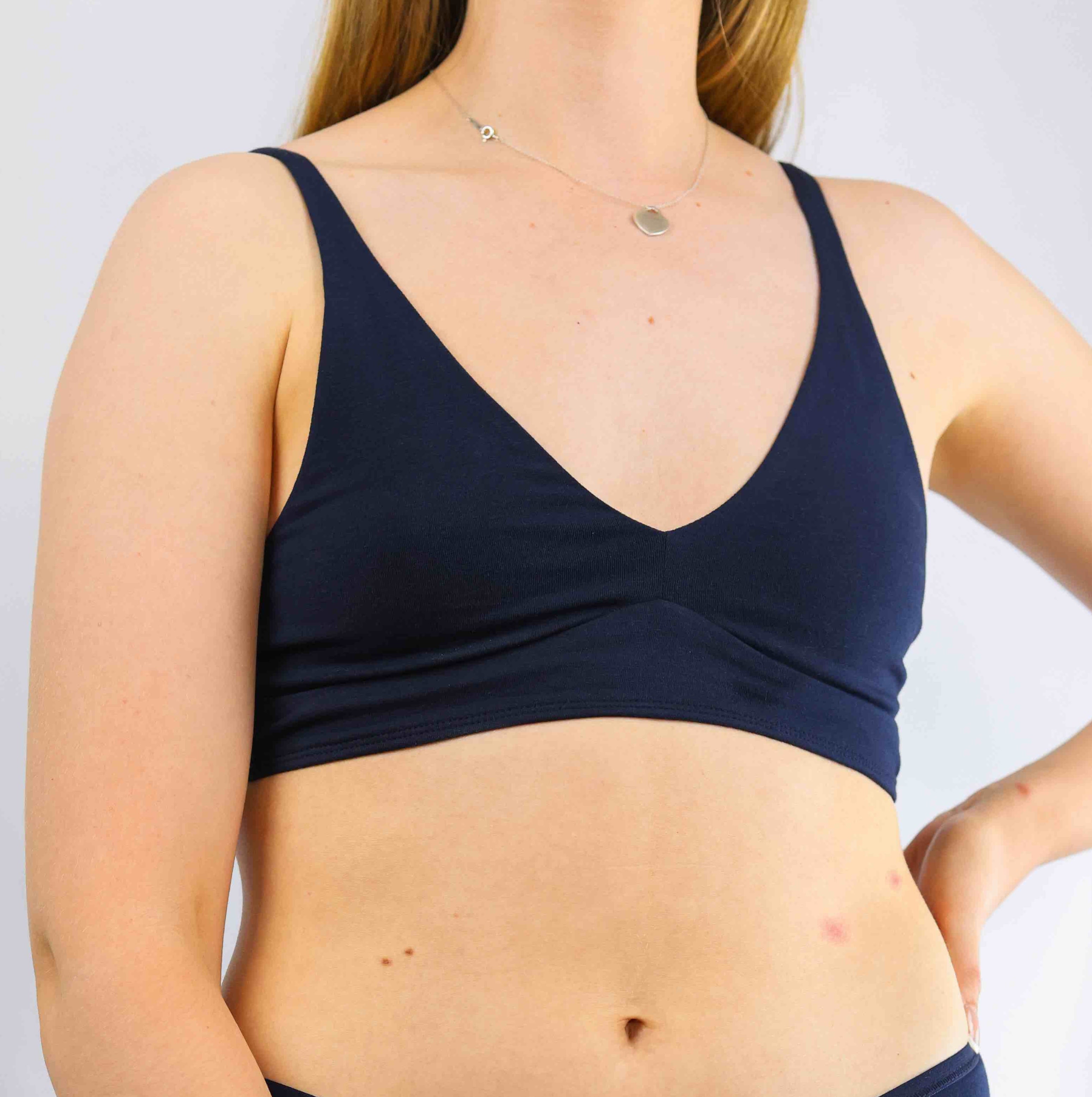 model wearing organic cotton bralette and mid rise bikini navy
