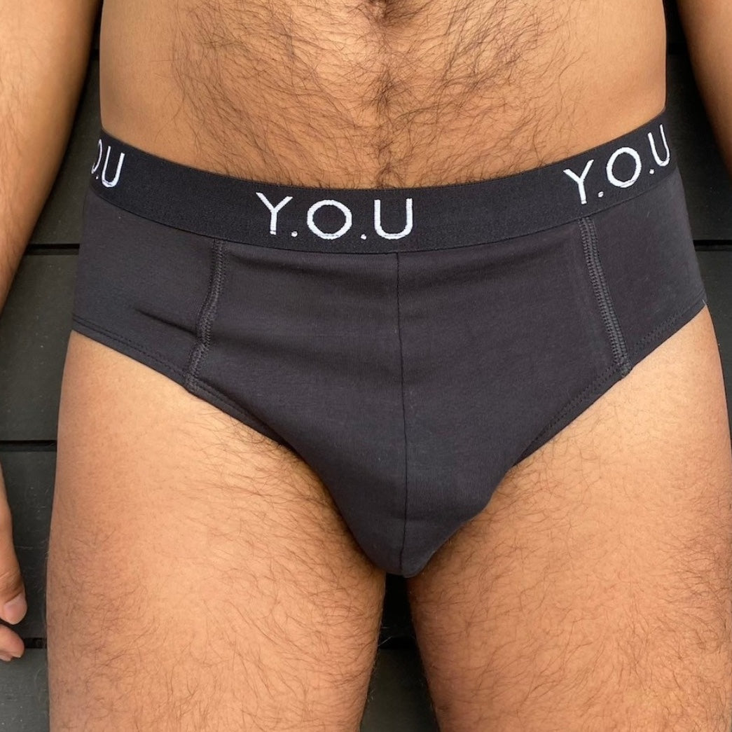 model wearing organic cotton briefs in black- Y.O.U Underwear