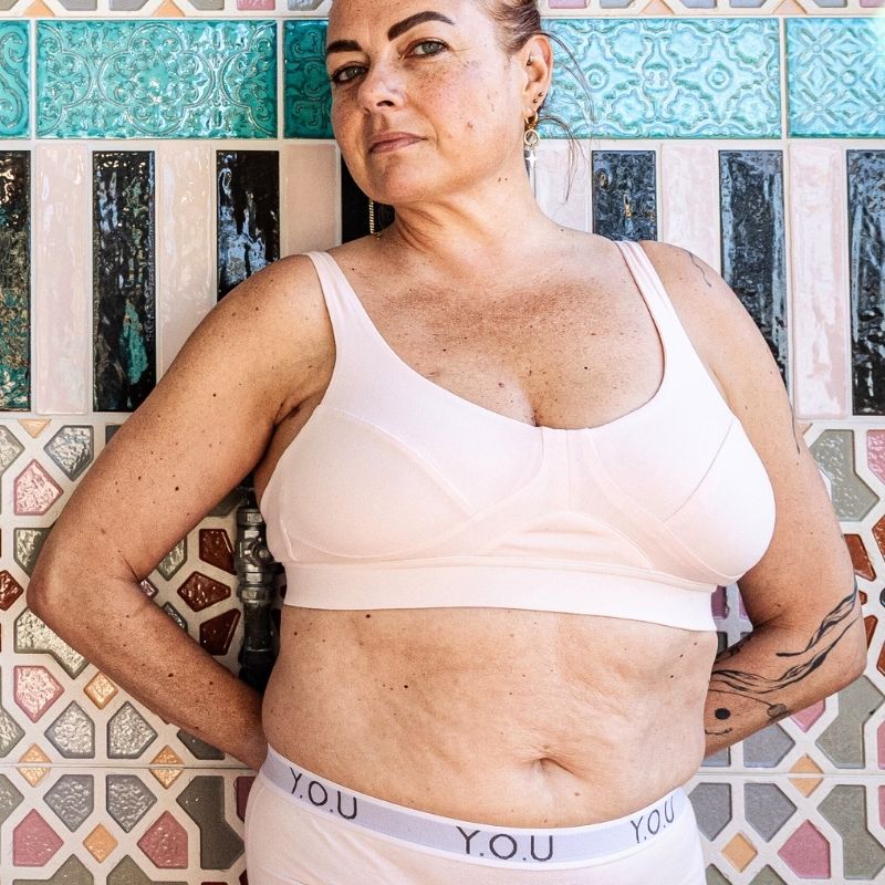 Woman wearing non wired bra in light pink