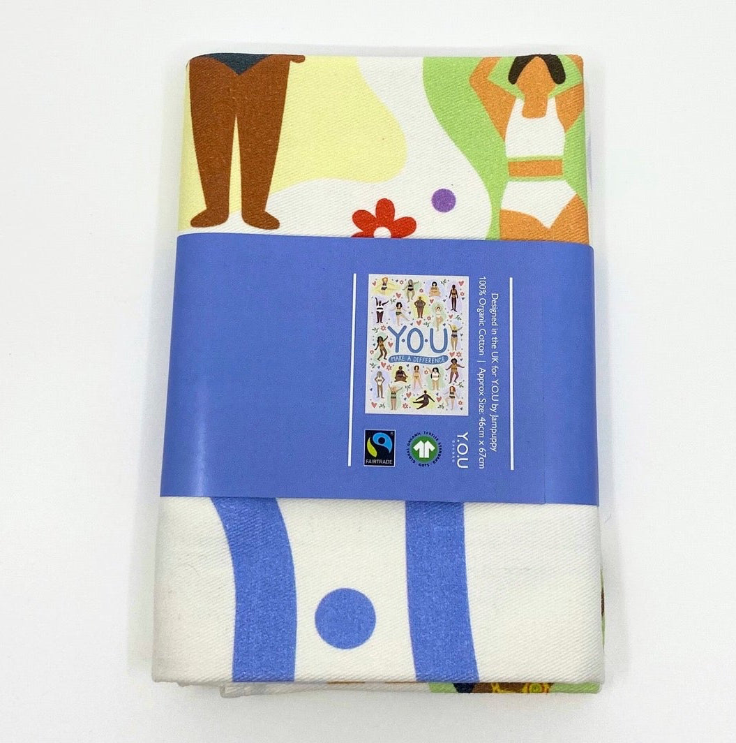 Organic cotton tea towel printed design with illustrations of different women wearing organic cotton underwear folded and wrapped - You Underwear