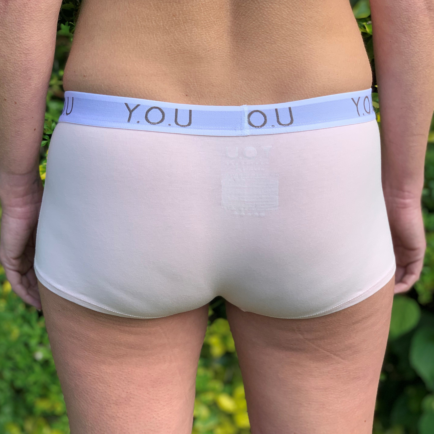 Women's organic cotton matching bralette and Y.O.U boy shorts set in light pink