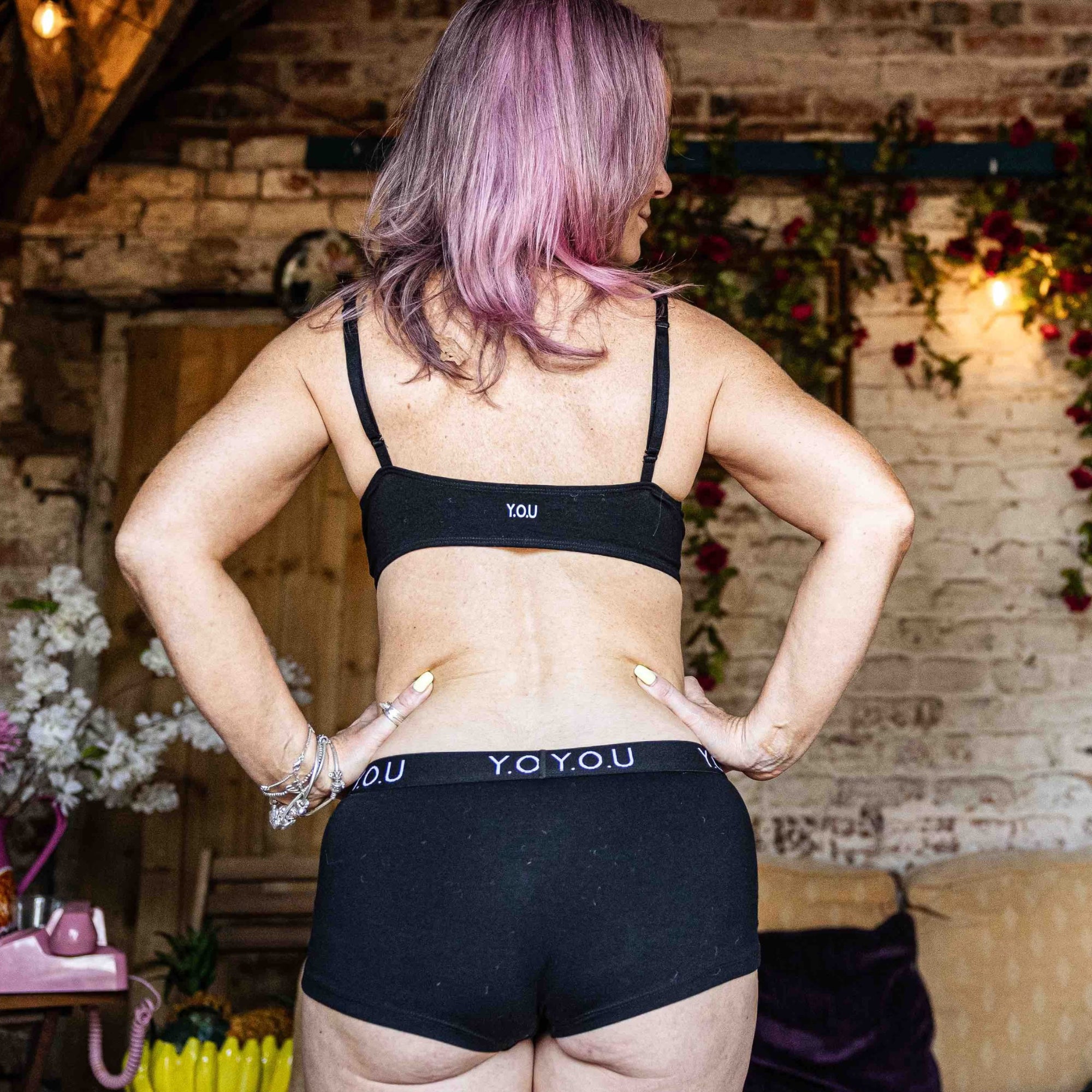 model wearing organic cotton matching set with a black bralette and YOU branded boy shorts - You Underwear