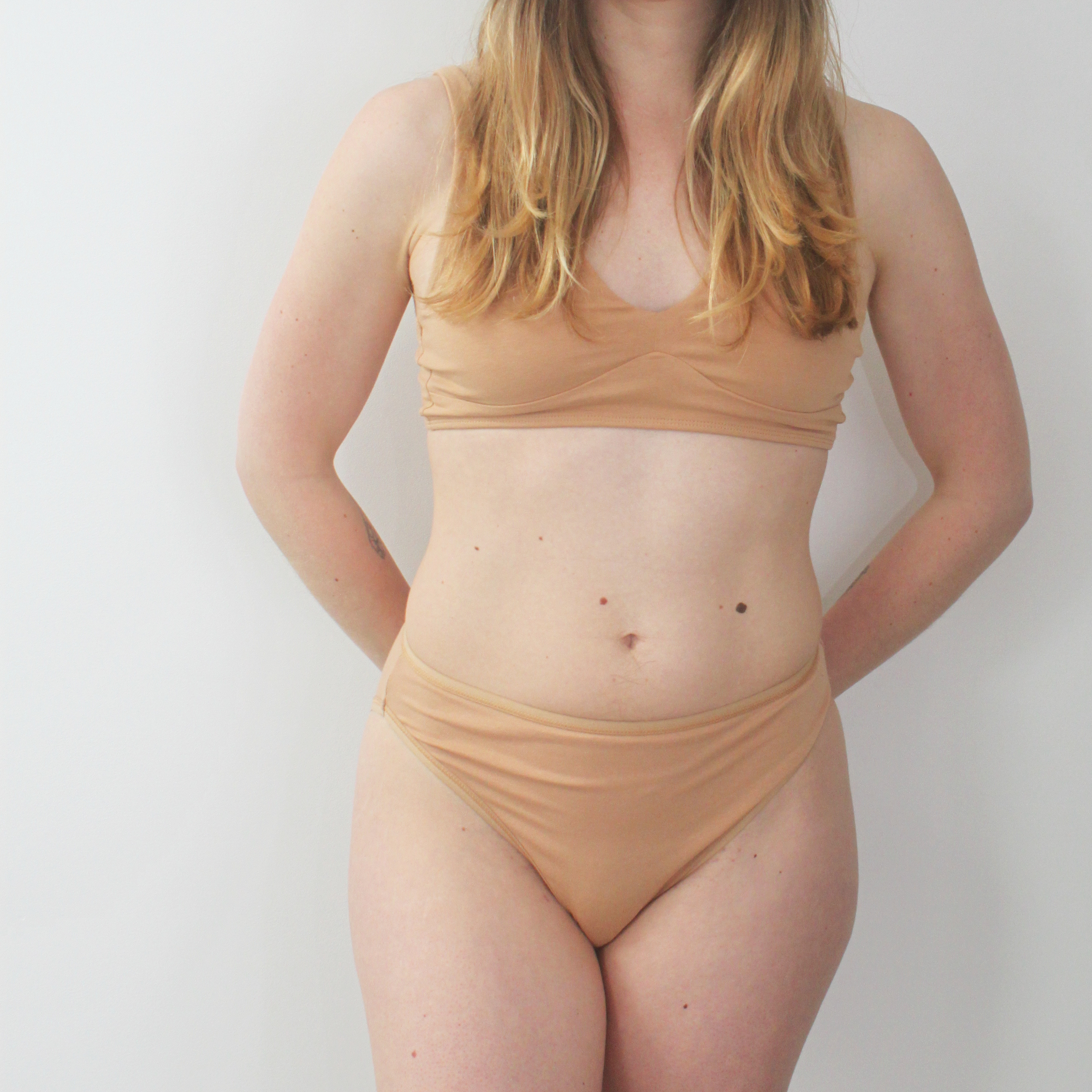 Women's organic cotton matching bralette and mid-rise bikini set - almond (light nude)