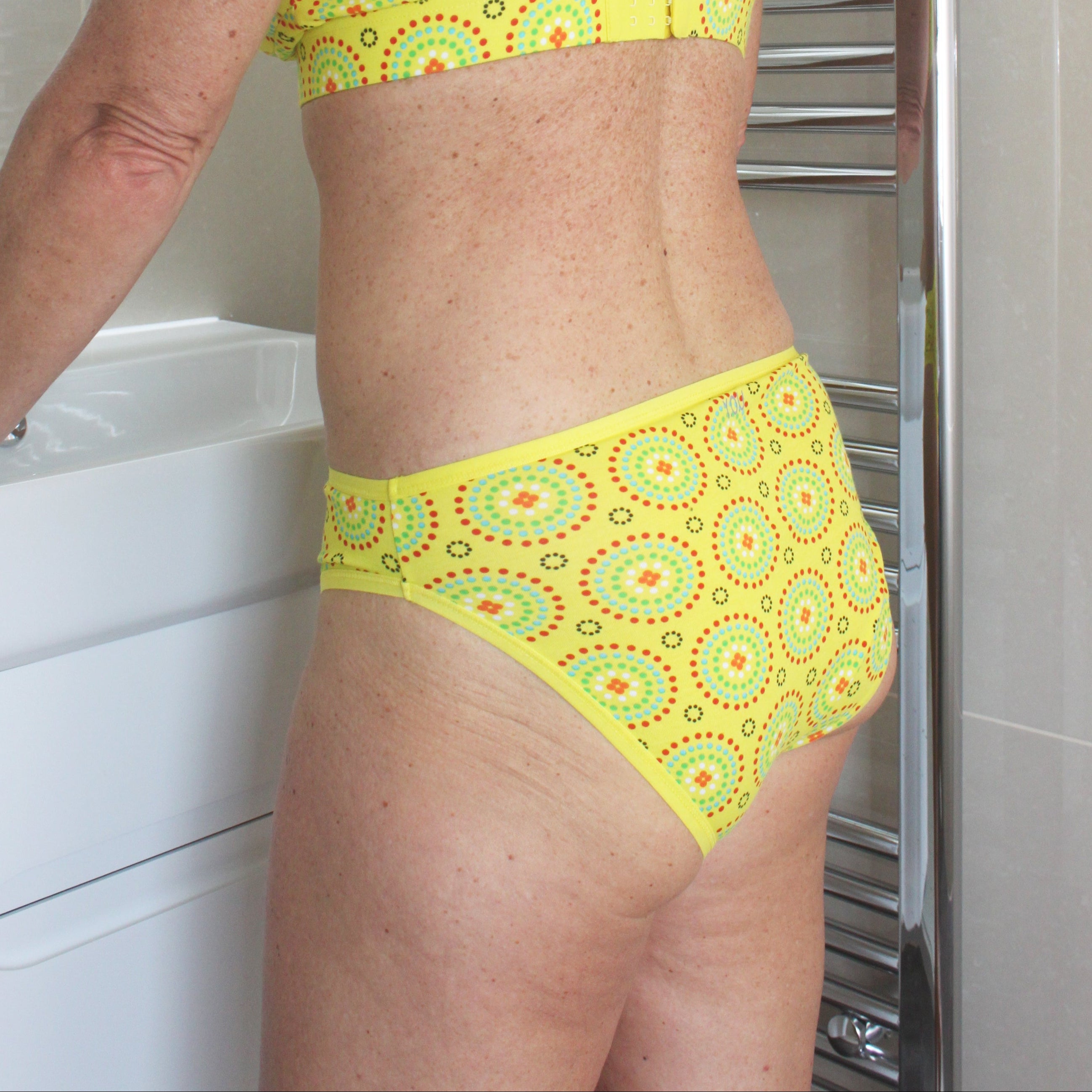 model wearing an organic cotton mid rise bikini in yellow mara-You Underwear