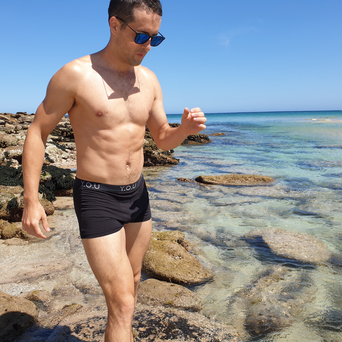 Black men's trunks beach shot (side view)