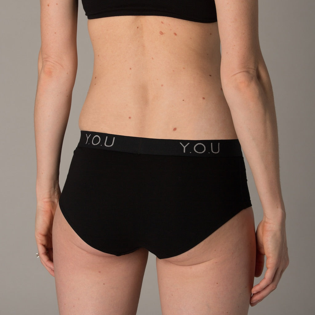 Women's black boy shorts with Y.O.U elastic waistband - back view