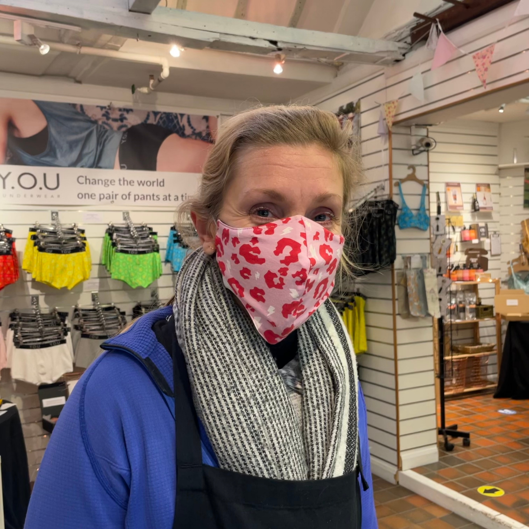 Blonde wearing a pink facemask