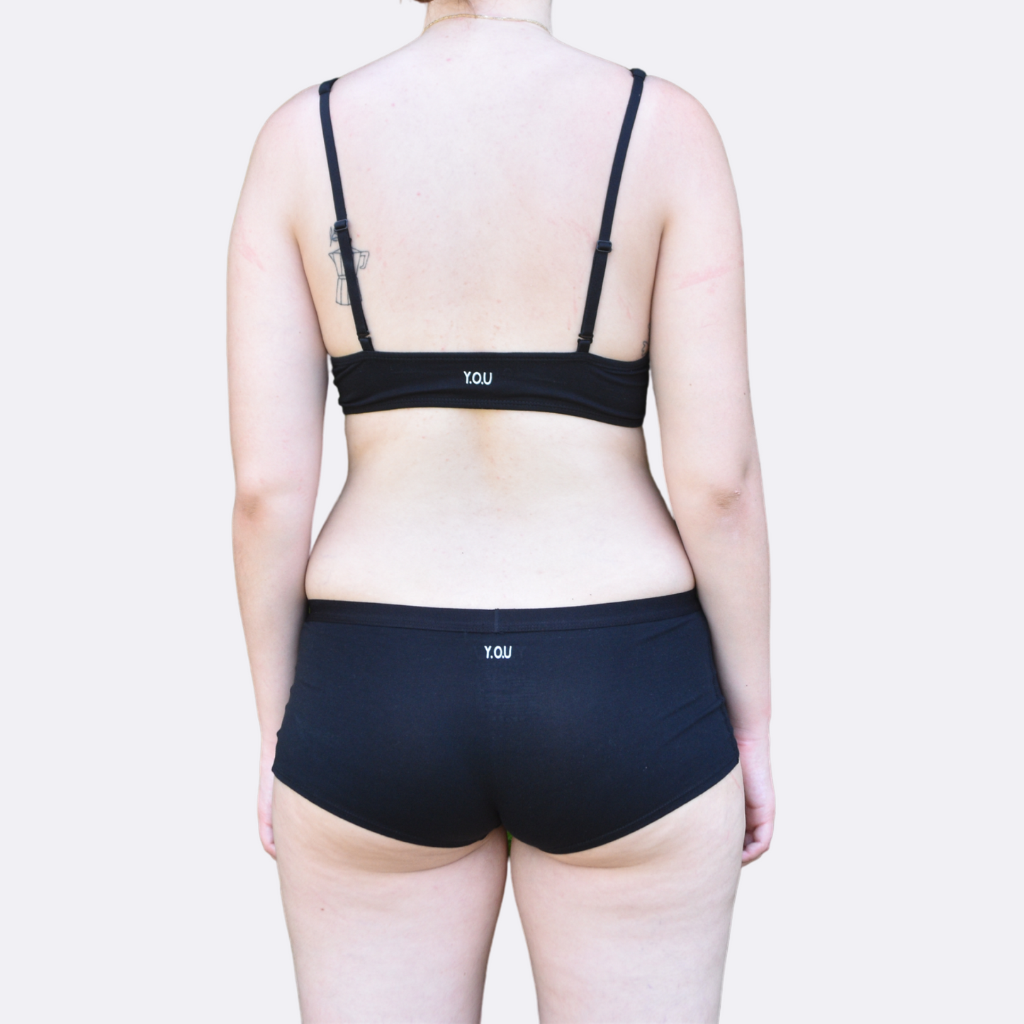 Women's black bralette and plain boy shorts - back view