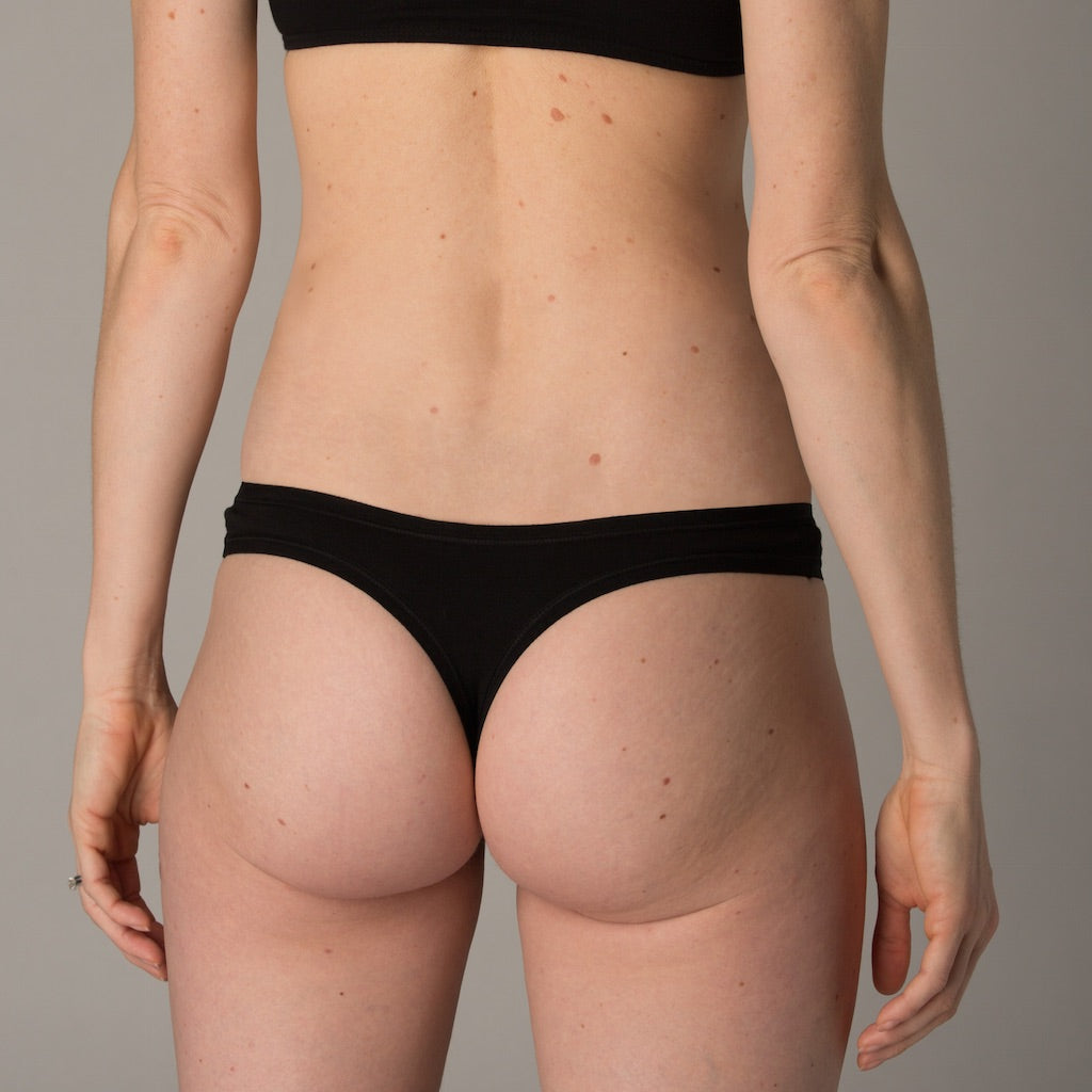 Women's black thong - side view