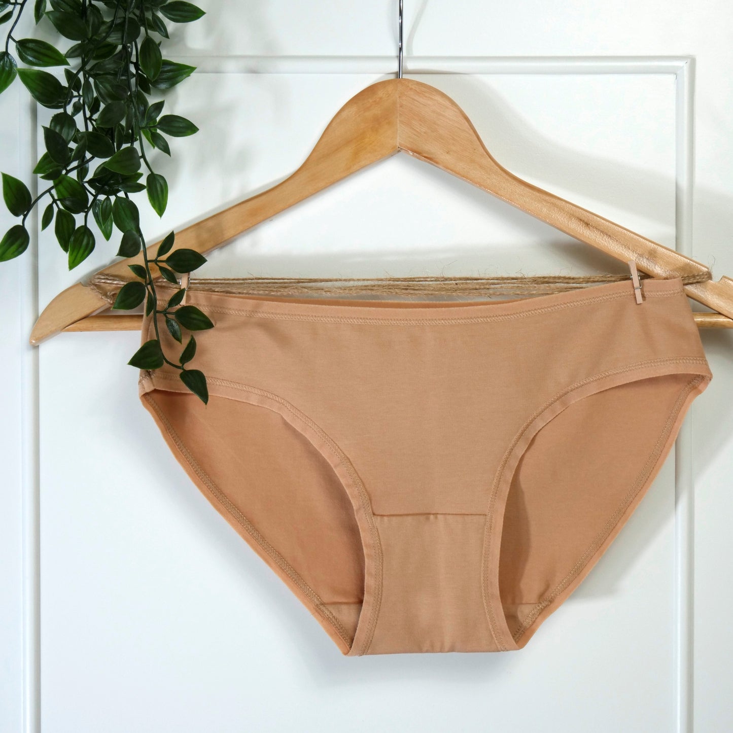Women's organic cotton low-rise bikini bottoms in almond (light nude)