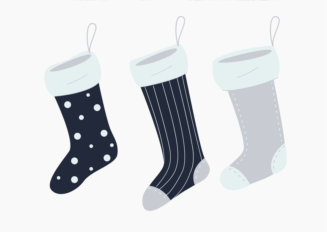 On a white background, 3 blue stockings are hanging