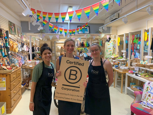 Keda, Sarah and Neve holding our B Corp Certification plaque in our Oxford Covered Market store