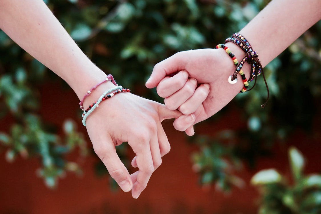 Friends holding hands