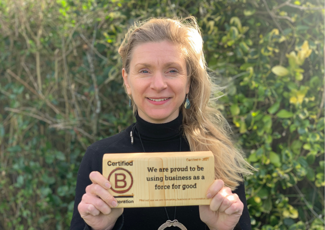Our CEO Sarah holds the B Corp Block