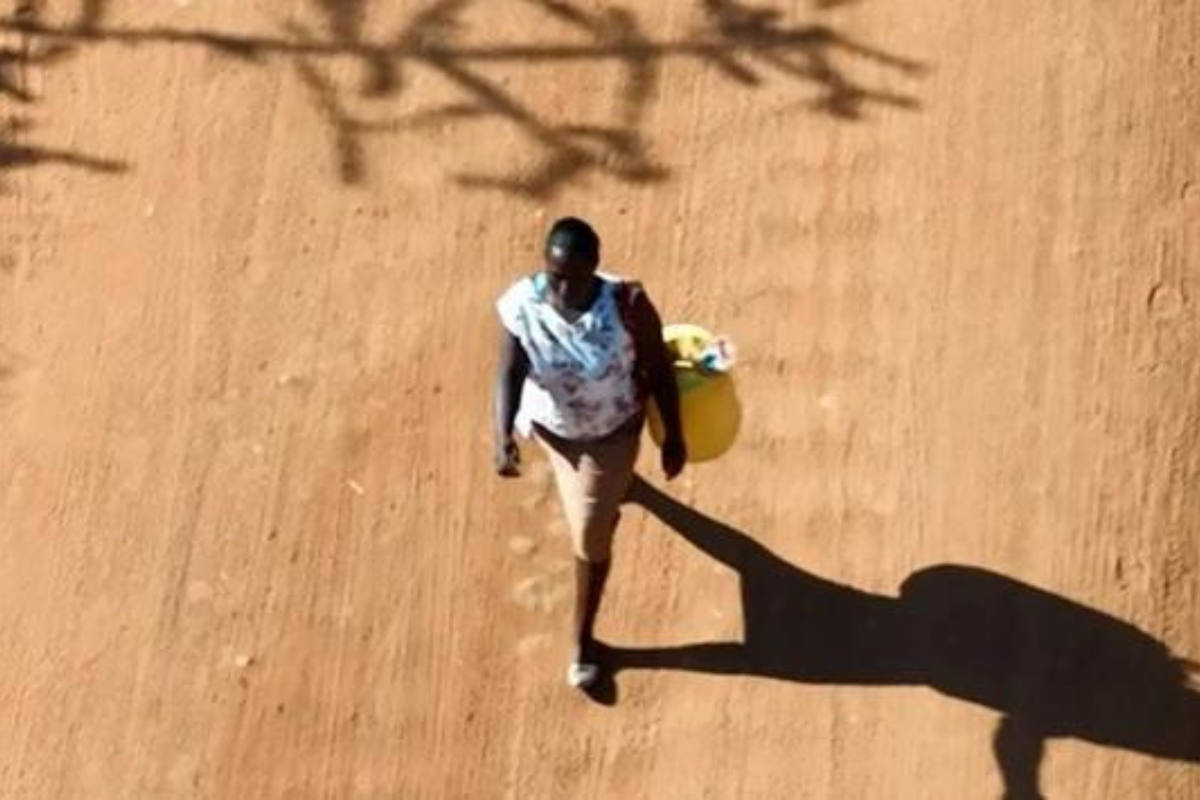 Ann walks to the well to collect water in Kenya