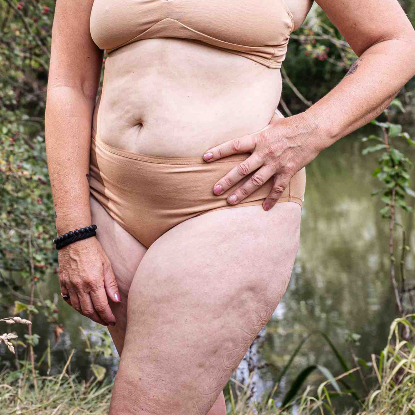model wearing organic cotton mid rise bikini almond - You Underwear