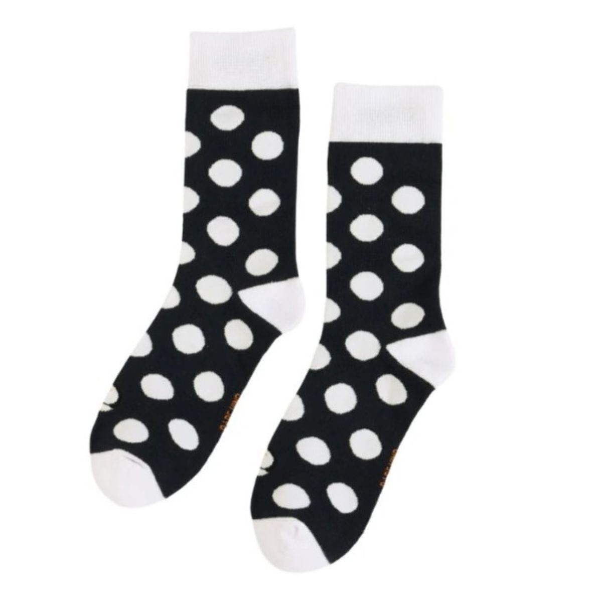 A flat lay picture of the Bare Kind polka dot puffin socks on a white background. The socks are black with white polka dots, cuffs, heels and toes.