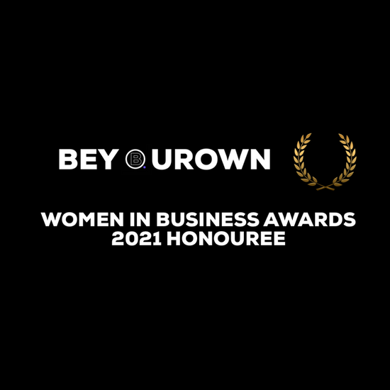 On a black background, the be your own woman in business awards logo