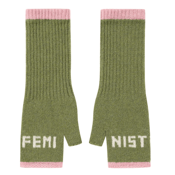 A flat lay photo of the Black & Beech Feminist Gloves in pistachio green with white writing and light pink cuffs.