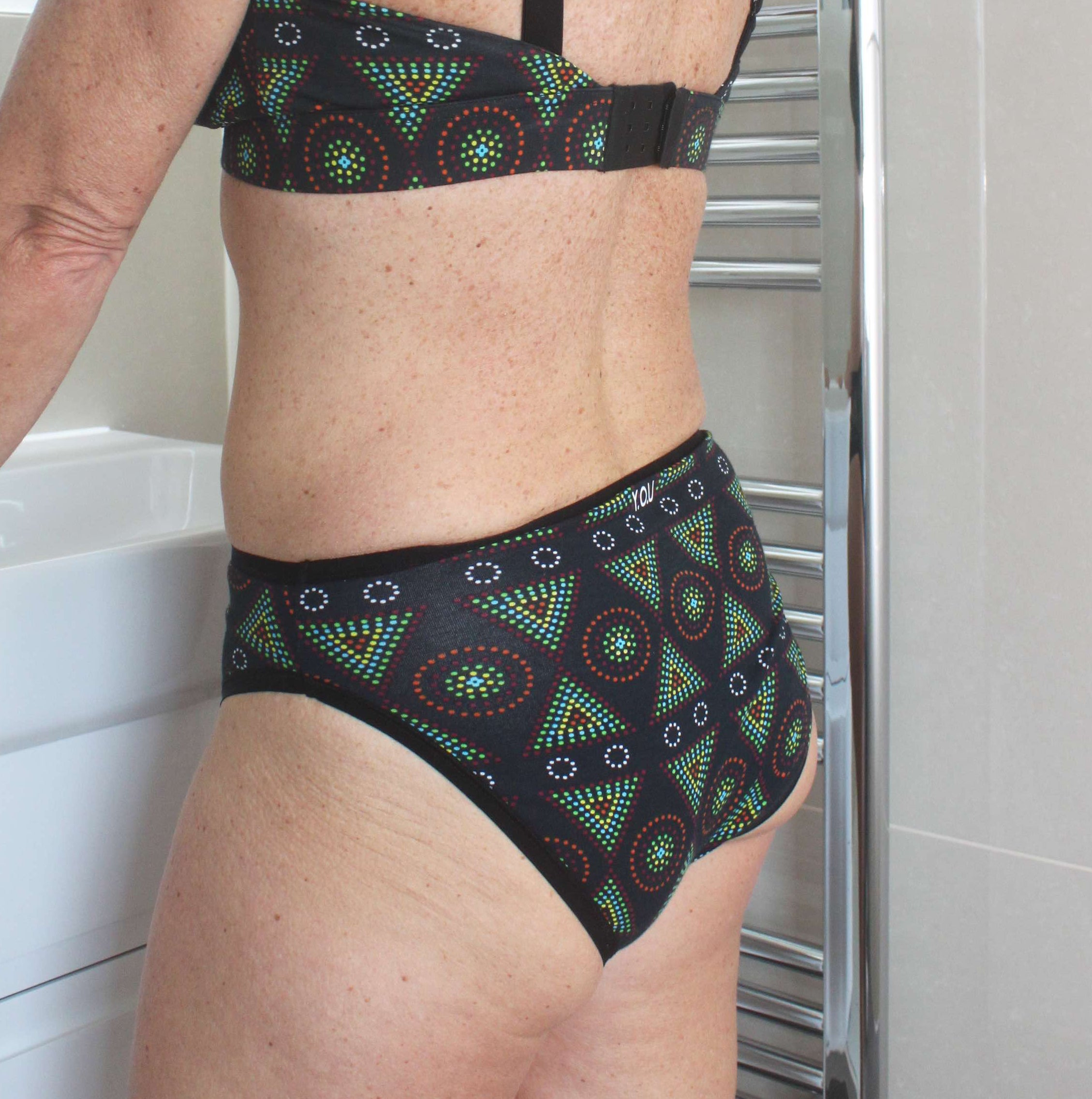 model wearing organic cotton mid rise bikini black mara print - You Underwear