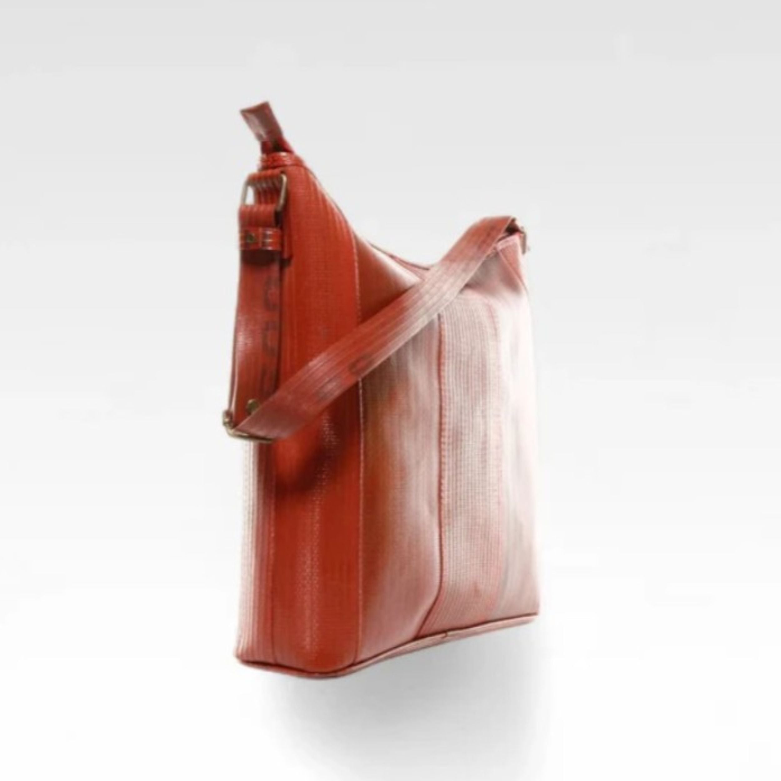 A photo of the Elvis & Kresse red Tooley Tote bag on a white background