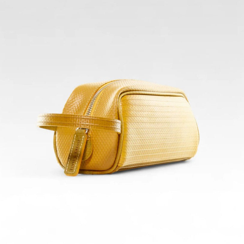 The Elvis and Kresse Yellow Travel Case on a white background