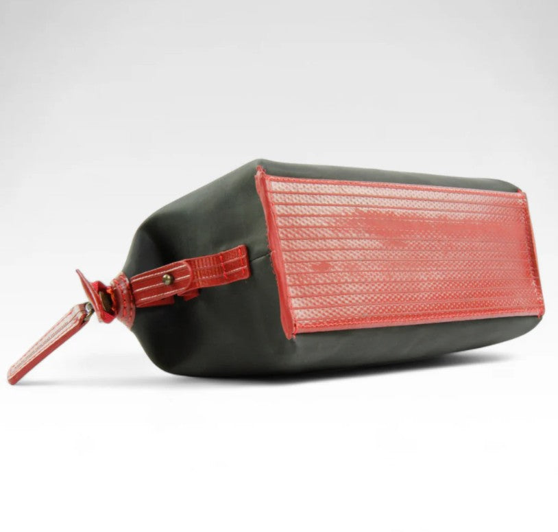 Elvis and Kresse black and red washbag on its side on a white background