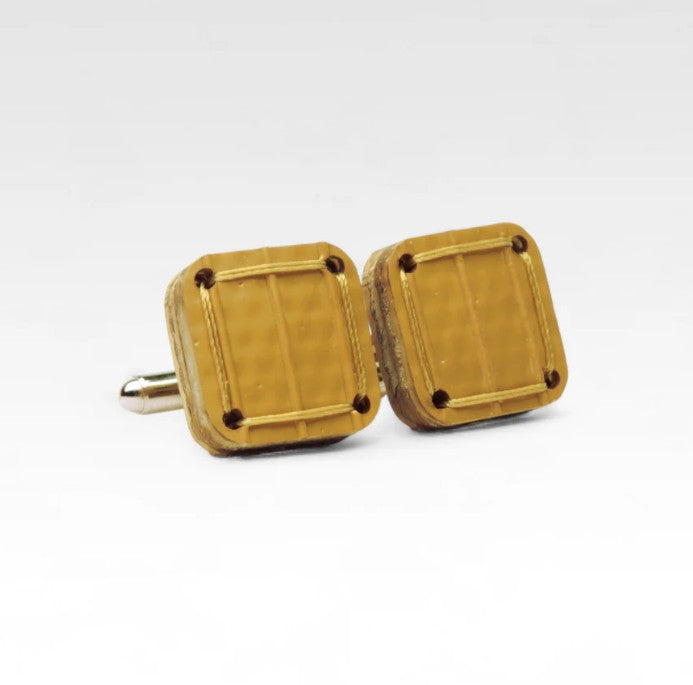 The Elvis and Kresse yellow cufflinks on a white background