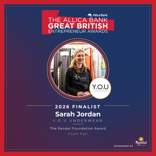 A blue and red image which reads, 'The Allica Bank Great British Entrepreneur Awards. 2026 Finalist Sarah Jordan Y.O.U Underwear. The Randal Foundation Award, South East.' There is a picture of the founder, Sarah Jordan in the YOU Underwear oxford shop in the center and the black and white YOU Underwear logo to the right.