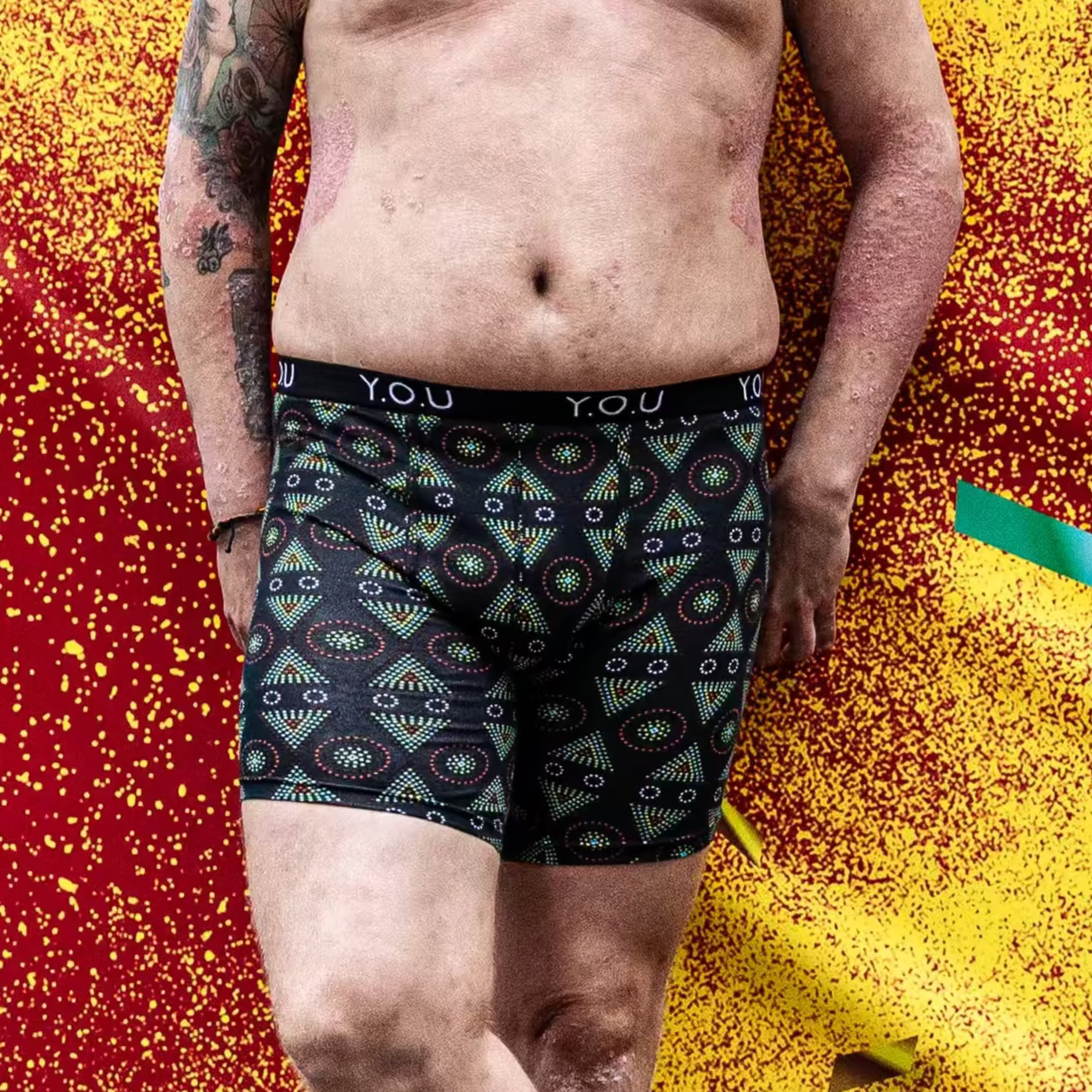 model wearing organic cotton longer leg style trunks in black mara- You Underwear