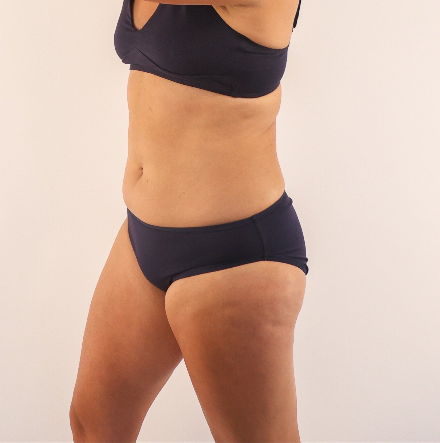 model wearing organic cotton low rise bikini navy - You Underwear