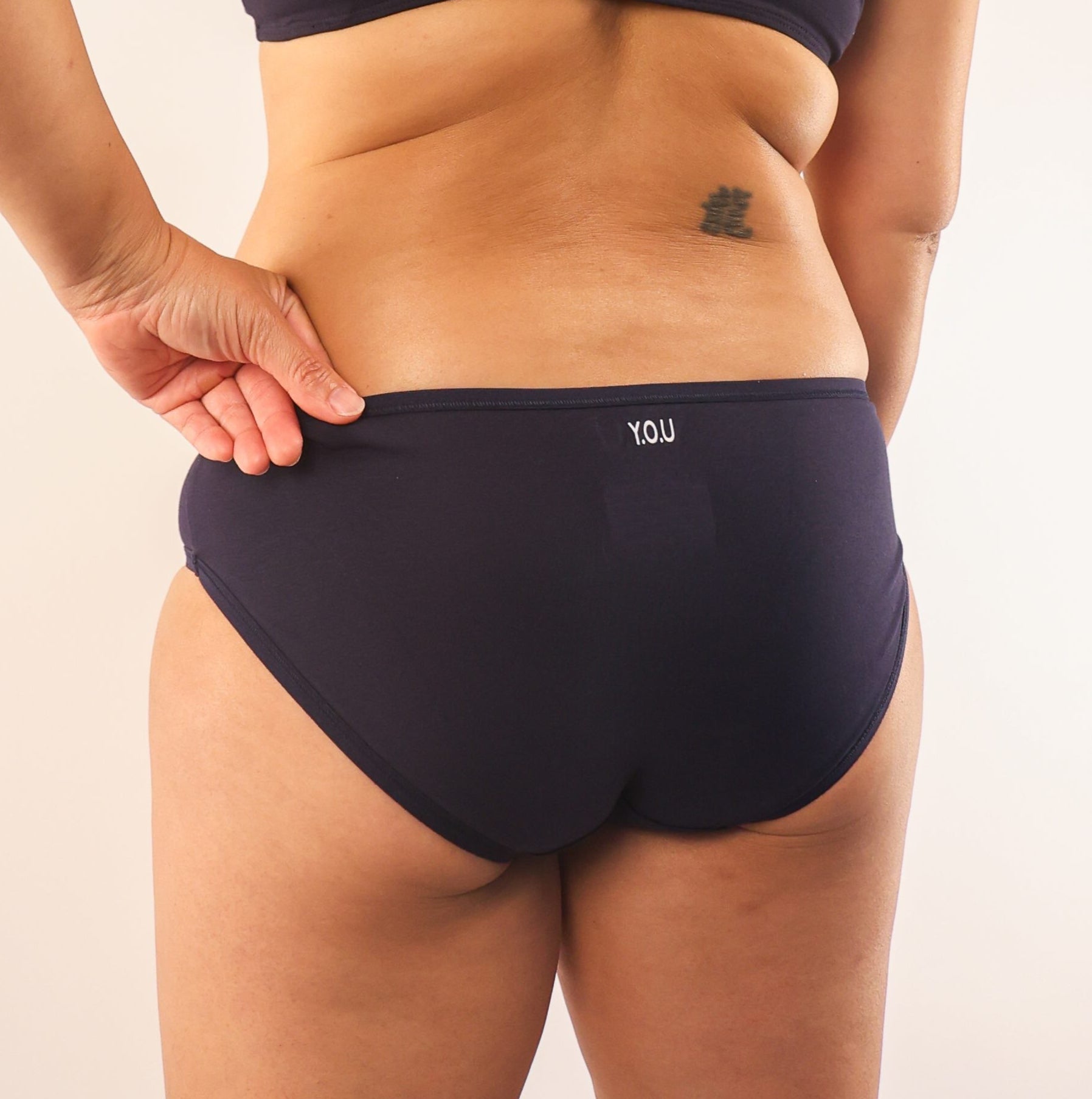 model wearing organic cotton low rise bikini navy - You Underwear