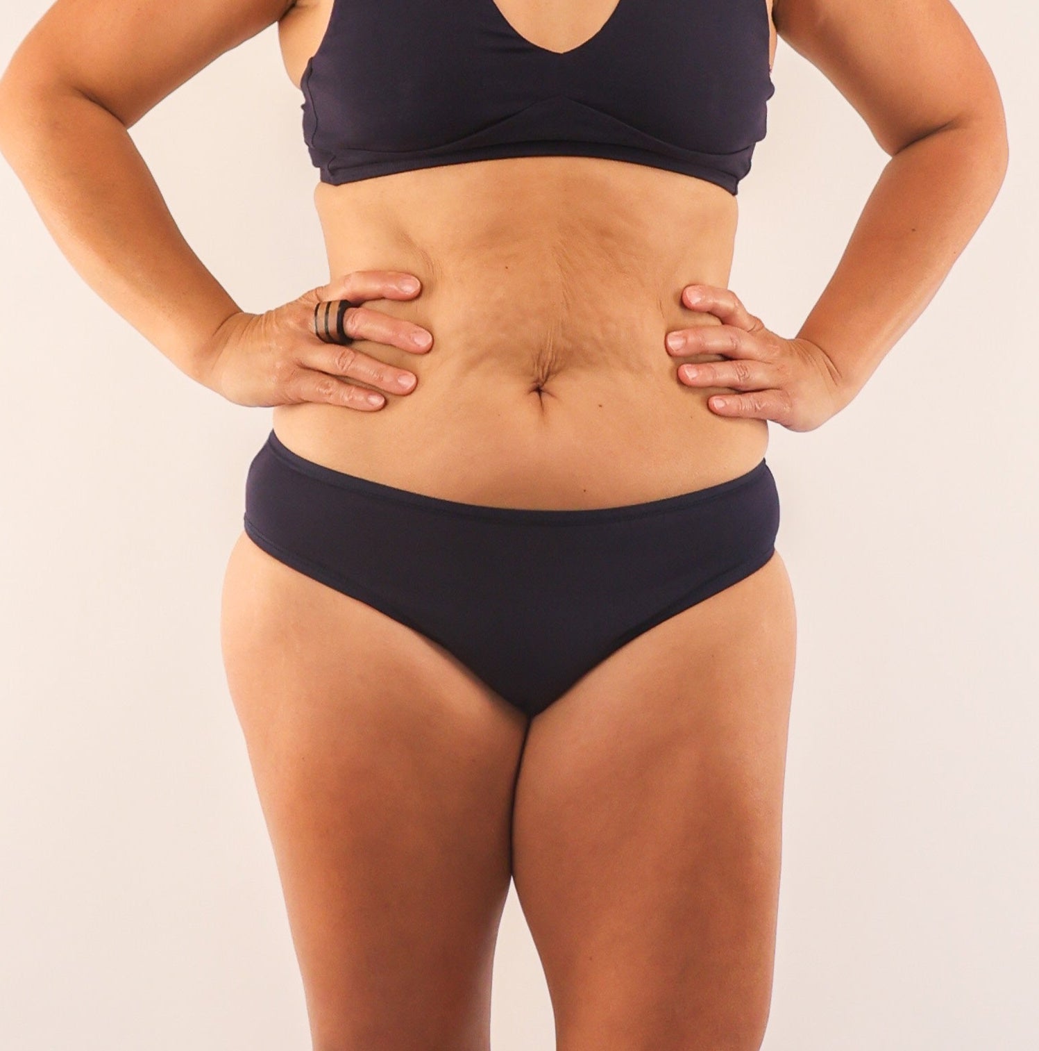 model wearing organic cotton low rise bikini navy - You Underwear