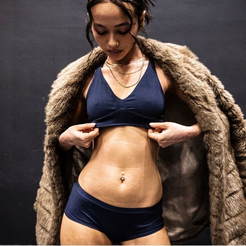 model wearing a navy blue organic cotton matching set with a bralette and boyshorts - You Underwear