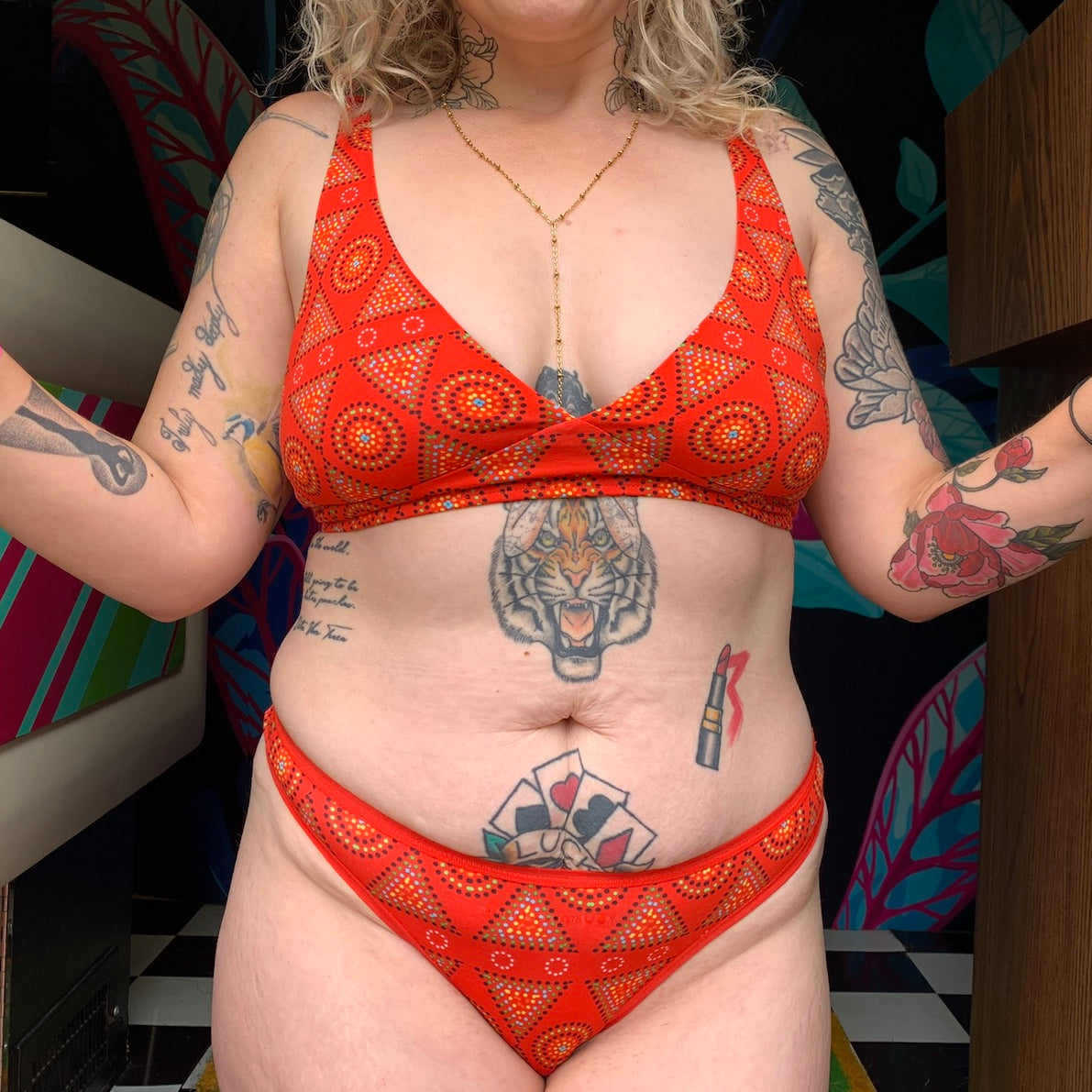 model wearing a red mara patterned organic cotton matching set with a bralette and thong - You Underwear