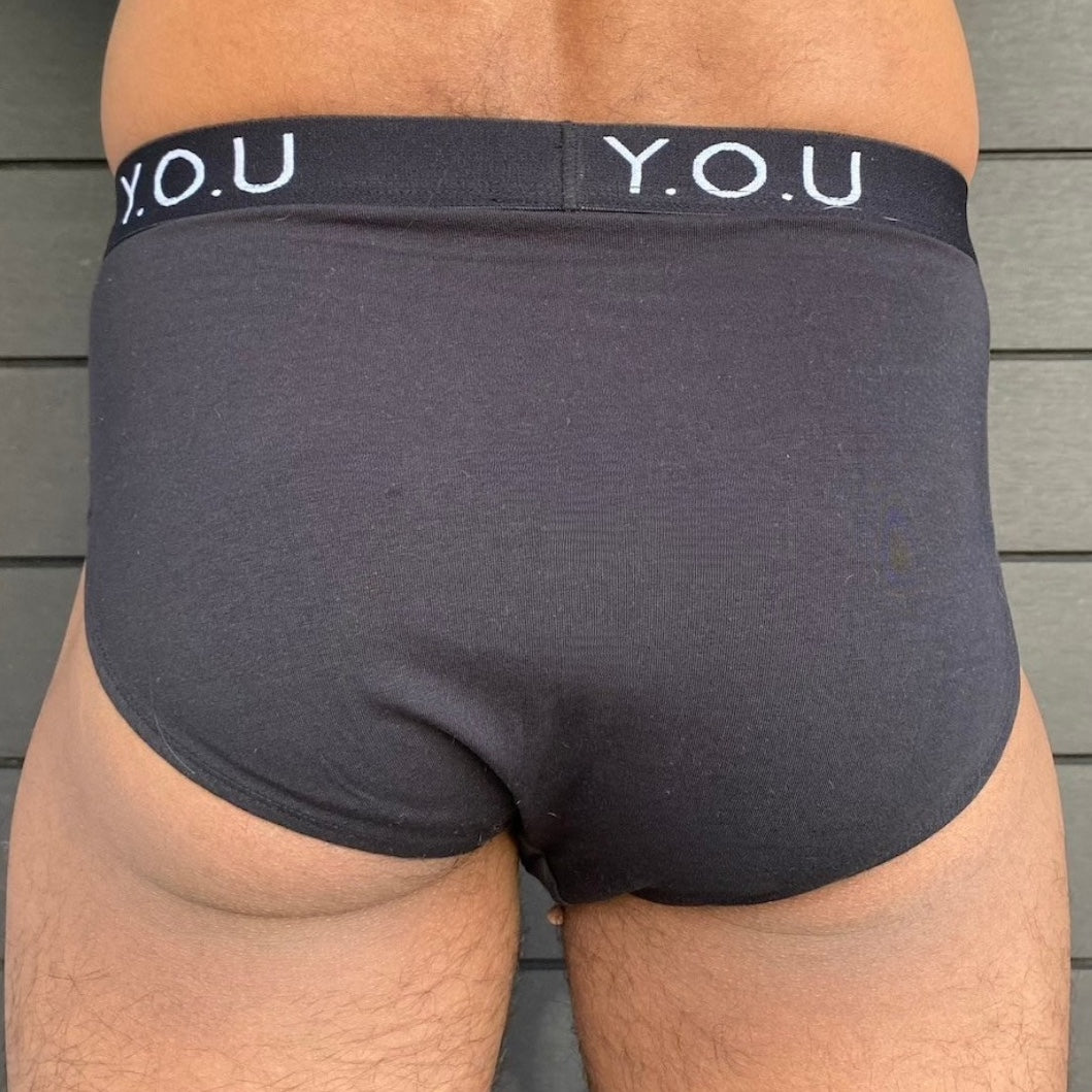model wearing organic cotton briefs in black- Y.O.U Underwear
