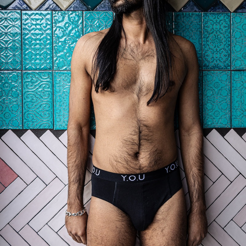 model wearing organic cotton briefs in black- Y.O.U Underwear