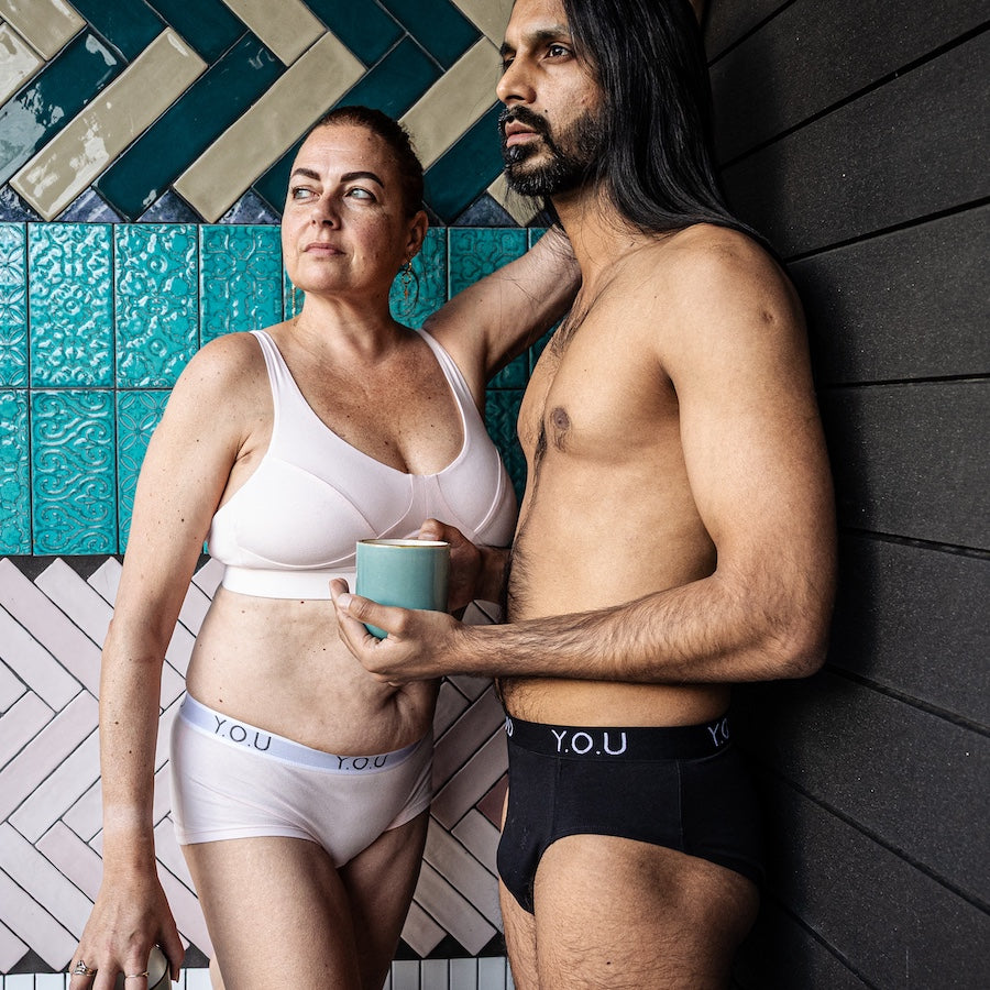 model wearing organic cotton briefs in black and a model wearing a matching underwear set in light pink - You Underwear