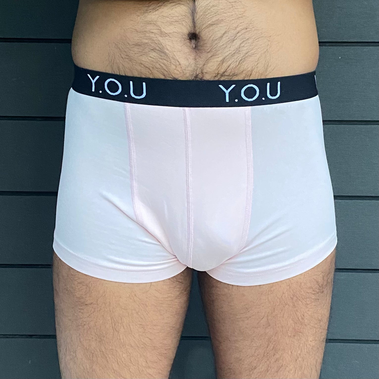 model wearing organic cotton men's hipster trunks in light pink - You Underwear